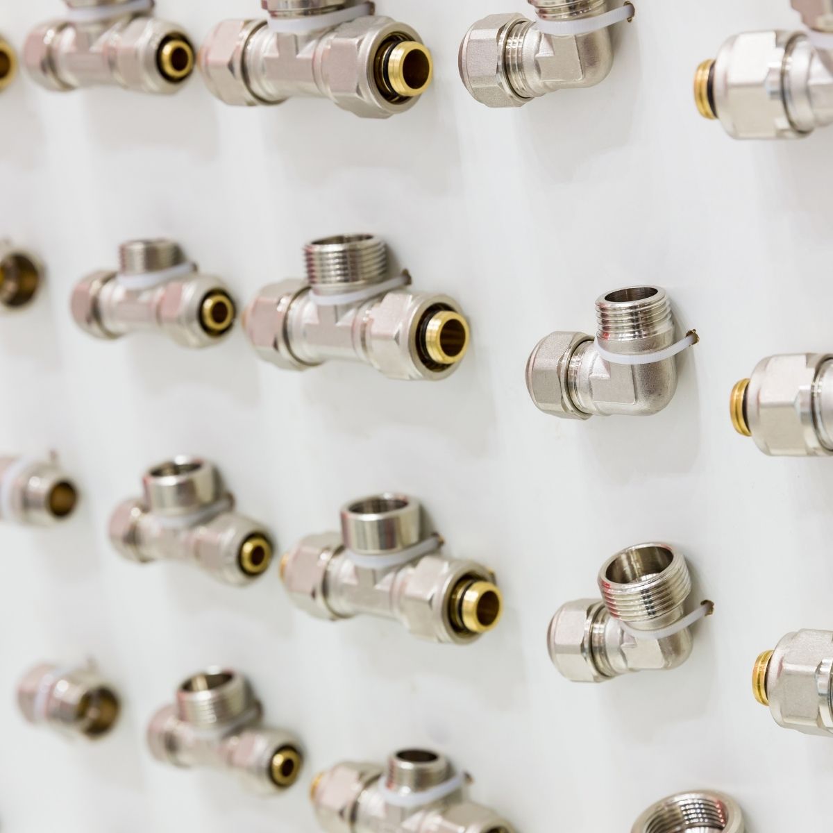 Unitwist fittings mounted in rows on a panel, provided by Sunridge Plumbing Solutions